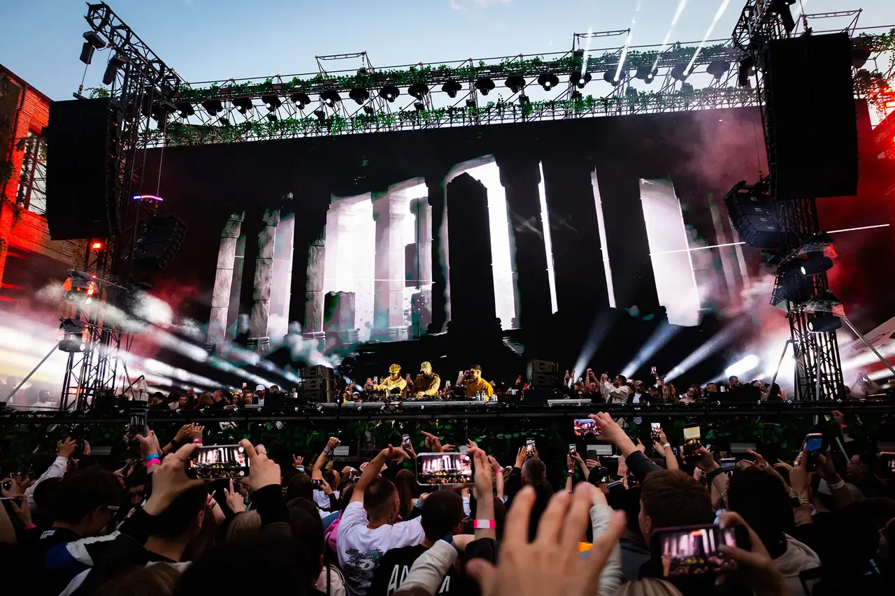 Wide shot of the show with audience filming