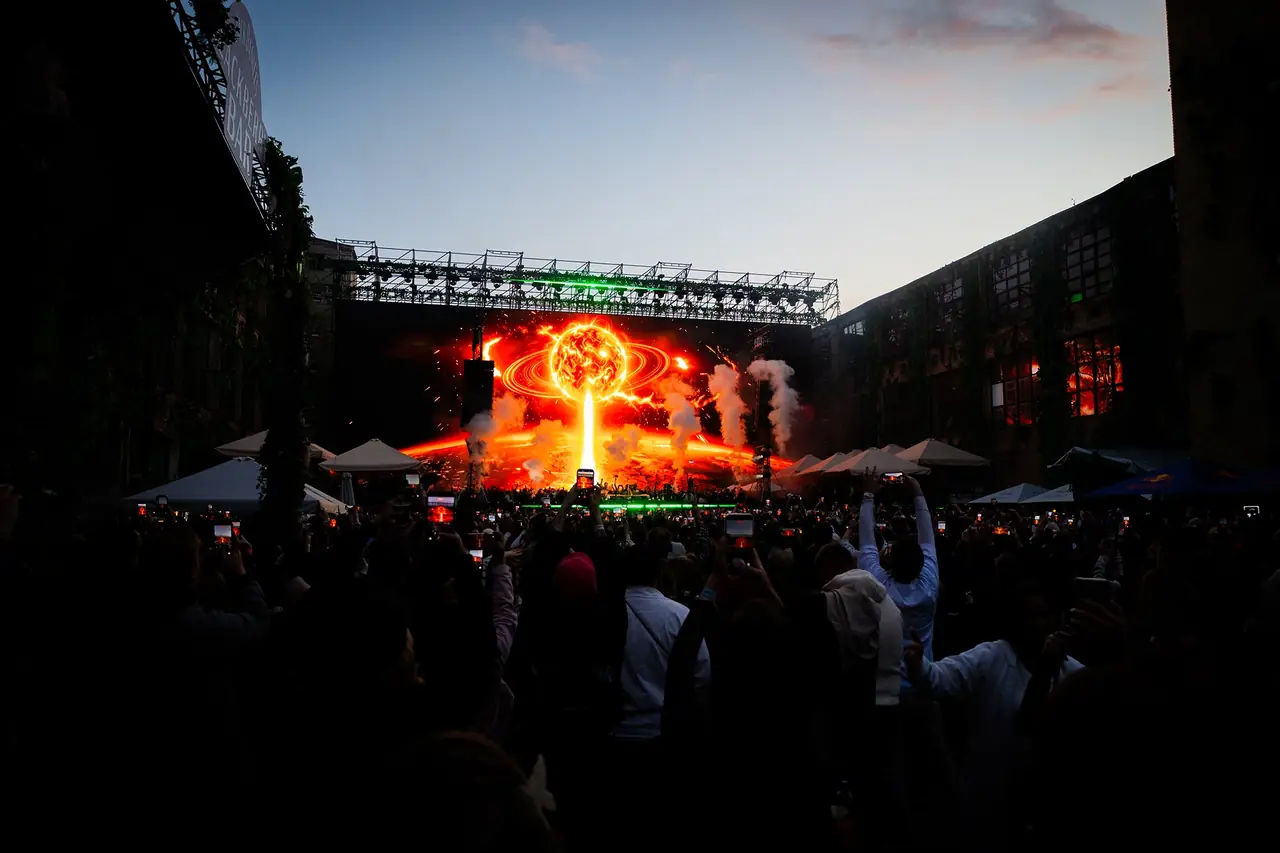 Concert crowd recording synchronized stage visuals